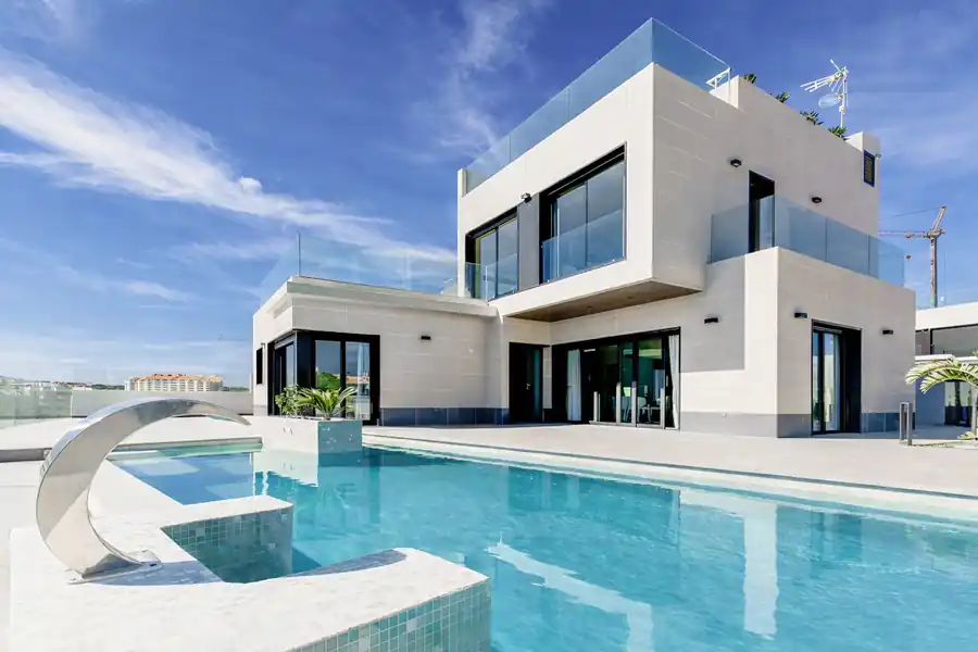 Landscape design inspiration with patio seating, planting, and exterior lighting